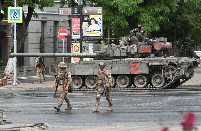 Fighters of Wagner private mercenary group are deployed in a street near the headquarters of the Southern Military District in the city of Rostov-on-Don, Russia on June 24, 2023. (Photo by Reuters/Stringer)