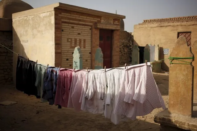 Laundry is hung out to dry in the Cairo Necropolis, Egypt, September 13, 2015. (Photo by Asmaa Waguih/Reuters)