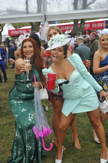 Racegoers enjoying Ladies Day at Aintree despite the rain at Grand National Festival 2023 in Liverpool, United Kingdom on April 14, 2023. (Photo by Splash News and Pictures)