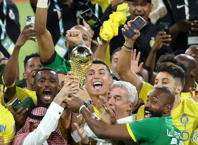 Cristiano Ronaldo of Al Nassr lifts the Arab Club Champions Cup trophy with teammates after the team's victory in the Arab Club Champions Cup Final between Al Hilal and Al Nassr at King Fahd International Stadium on August 12, 2023 in Riyadh, Saudi Arabia. (Photo by Yasser Bakhsh/Getty Images)