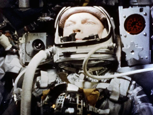 In this February 20, 1962 photo made available by NASA, astronaut John Glenn pilots the “Friendship 7” Mercury spacecraft during his historic flight as the first American to orbit the Earth. (Photo by NASA via AP Photo)