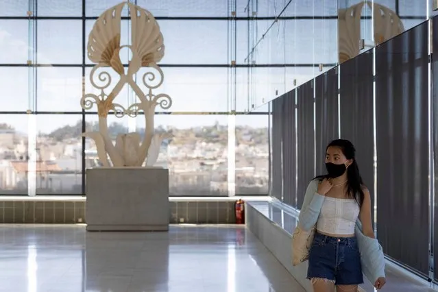 A woman visits the Parthenon Hall of the Acropolis Museum, as museums open following the easing of measures against the spread of the coronavirus disease (COVID-19), a day before the official opening of the tourism season, in Athens, Greece, May 14, 2021. Greece launched its tourism season Friday amid a competitive scramble across the Mediterranean to lure vacationers emerging from lockdowns. (Photo by Alkis Konstantinidis/Reuters)