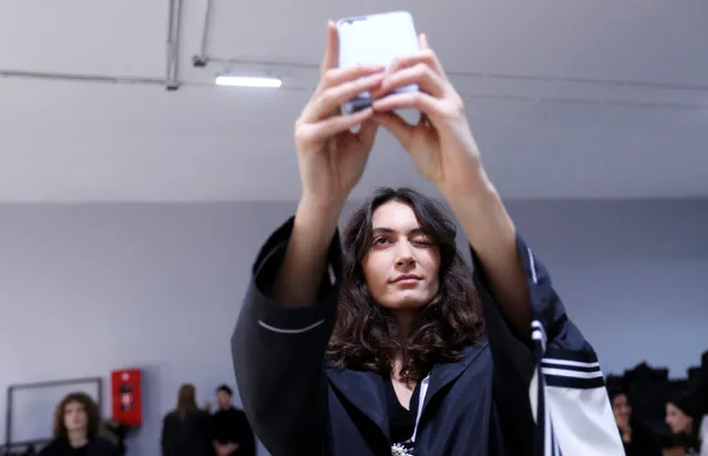 A model takes a selfie backstage during the Mercedes-Benz Fashion Week Tbilisi in Tbilisi, Georgia, November 1, 2018. (Photo by David Mdzinarishvili/Reuters)