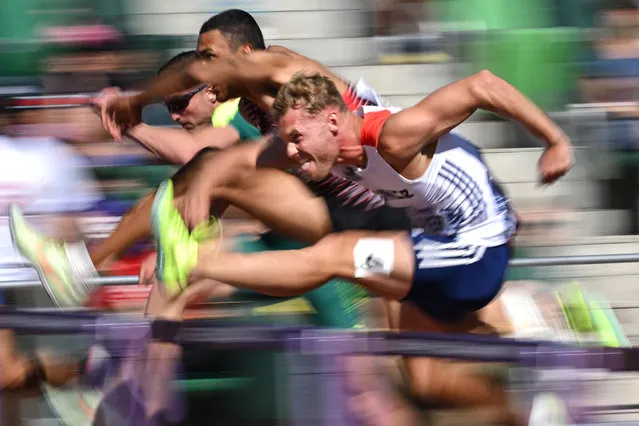 France's Kevin Mayer (R) competes in the men's 110m hurdles decathlon event during the World Athletics Championships at Hayward Field in Eugene, Oregon on July 24, 2022. (Photo by Ben Stansall/AFP Photo)