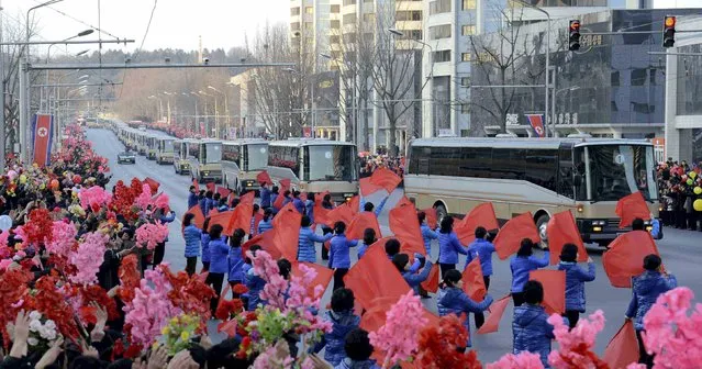People wave flags as members of operation team of Kwangmyongsong-4 long range rocket arrive at Pyongyang in this undated photo released by North Korea's Korean Central News Agency (KCNA) on February 10, 2016. (Photo by Reuters/KCNA)
