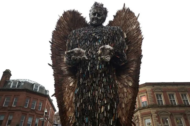 The Knife Angel sculpture, also known as The National Monument Against Violence and Aggression, created by artist Alfie Bradley from over 100.000 knives obtained from knife amnesties and weapons seized by British police forces, is seen on display as part of a national tour in Bolton, Britain on November 6, 2023. (Photo by Phil Noble/Reuters)