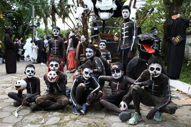 Revellers participate in a parade known as “La Calabiuza” to celebrate the Day of the Dead in Tonacatepeque, El Salvador on November 4, 2023. (Photo by Jose Cabezas/Reuters)