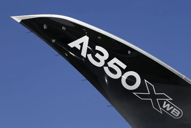 A view of the wingtip of an Airbus A350 XWB aircraft displayed during the opening day of the Singapore Airshow at Changi Exhibition Center February 16, 2016. (Photo by Edgar Su/Reuters)