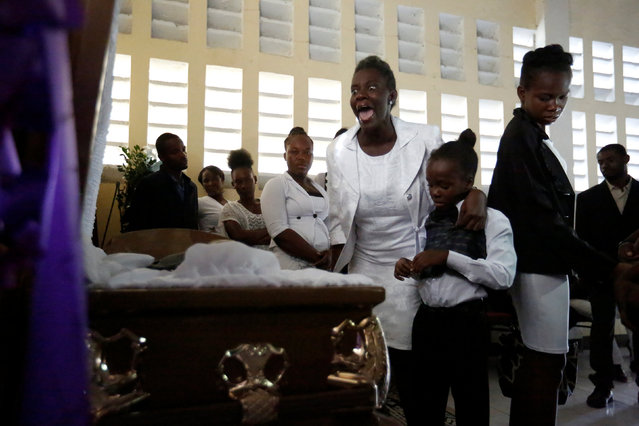 Marie Joseph Cesar reacts as she pays her respects to her late brother Mackerson Joseph, who was killed during anti-government protests, before a mass at a church in Port-au-Prince, Haiti March 4, 2019. (Photo by Jeanty Junior Augustin/Reuters)