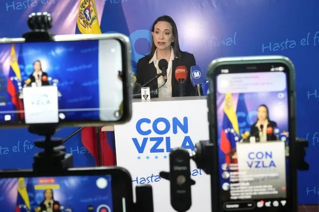 Opposition presidential hopeful Maria Corina Machado gives a press conference at her campaign headquarters in Caracas, Venezuela, Friday, December 15, 2023. (Photo by Matias Delacroix/AP Photo)