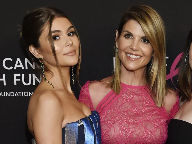 In this February 28, 2019 file photo, actress Lori Loughlin poses with her daughter Olivia Jade Giannulli, left, at the 2019 “An Unforgettable Evening” in Beverly Hills, Calif. Felicity Huffman and Loughlin have worked steadily as respected actresses and remained recognizable if not-quite-A-list names for decades. Neither has ever had a whiff of criminality or scandal tied to their name until both were charged with fraud and conspiracy Tuesday along with dozens of others in a scheme that according to federal prosecutors saw wealthy parents pay bribes to get their children into some of the nation’s top colleges. (Photo by Chris Pizzello/Invision/AP Photo)
