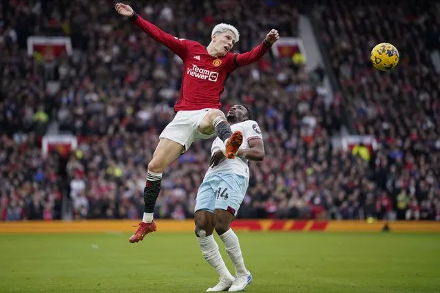 Manchester United's Alejandro Garnacho, left, vies for the ball with West Ham's Mohammed Kudus during the English Premier League soccer match between Manchester United and West Ham United at the Old Trafford stadium in Manchester, England, Sunday, February 4, 2024. (Photo by Dave Thompson/AP Photo)