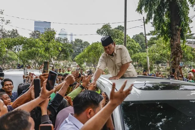 Indonesian presidential candidate Prabowo Subianto (C) greets his supporters after visiting his father’s grave at a cemetery in Jakarta, Indonesia, 15 February 2024. Prabowo has claimed victory in Indonesia’s Presidential Elections over rivals Anies Baswedan and Ganjar Pranowo based on early counts. (Photo by Mast Irham/EPA)