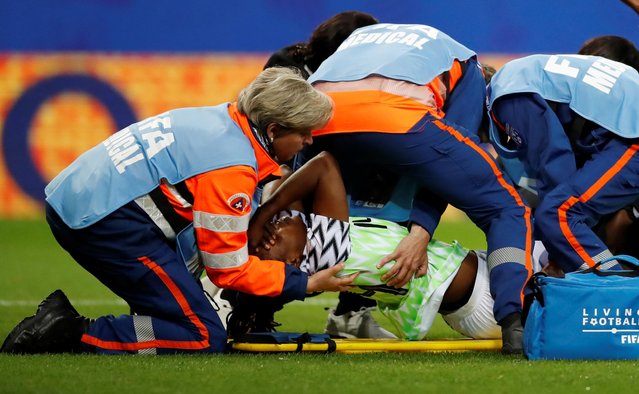 Nigeria's defender Faith Michael is evacuated on a stretcher after getting injured during the 2019 Women's World Cup Group A football match between Norway and Nigeria, on June 8, 2019, at the Auguste-Delaune Stadium in Reims, eastern France. (Photo by Christian Hartmann/Reuters)