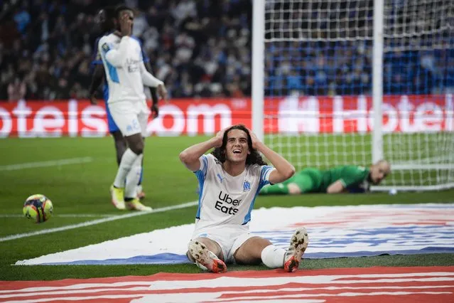 Marseille's Matteo Guendouzi reacts after missing a shot on goal during a French League One soccer match between Marseille and Reims at the Velodrome stadium in Marseille, France, Wednesday, December 22, 2021. (Photo by Daniel Cole/AP Photo)