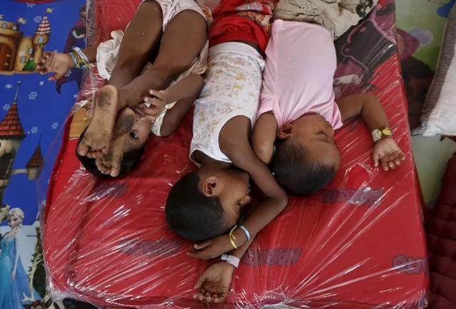 Young Rohingya migrants, who arrived recently by boat, rest at a temporary shelter in Kuala Langsa, in Indonesia's Aceh Province May 25, 2015. (Photo by Nyimas Laula/Reuters)