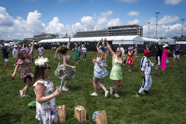 Spectators dance in the infield before the 150th running of the Kentucky Derby at Churchill Downs in Louisville, KY on Saturday, May 04, 2024. (Photo by Jabin Botsford/The Washington Post)