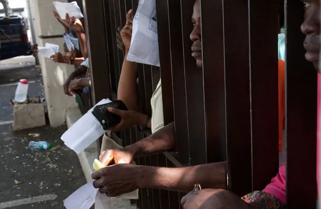 Haitian immigrants wait their turn to register for legal residency at the Interior Ministry in Santo Domingo, Dominican Republic, Tuesday, June 16, 2015. The head of the immigration agency in the Dominican Republic says the country is ready to resume deporting non-citizens without legal residency after putting the practice on hold for a year. (AP Photo/Tatiana Fernandez)