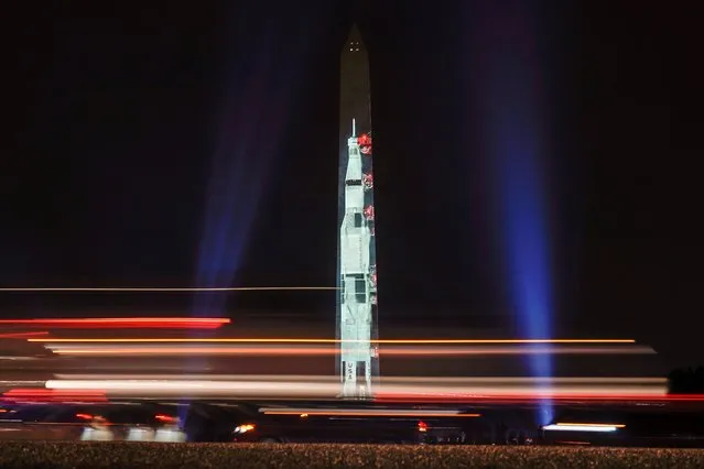 An image of the Saturn V rocket, which launched the Apollo 11 astronauts into space, is projected onto the side of the Washington Monument to mark the 50th anniversary of the lunar mission in Washington, U.S., July 16, 2019. (Photo by Joshua Roberts/Reuters)