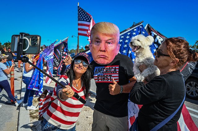 Supporters of former US President Donald Trump protest near Mar-a-Lago Club in Palm Beach, Florida, on March 21, 2023. The former president is expected to be indicted over hush money paid to a p*rn actress, with Trump calling for mass demonstrations if he is charged. (Photo by Giorgio Viera/AFP Photo)