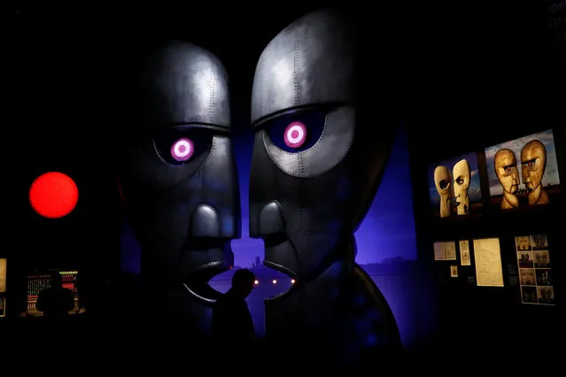 Visitors are silhouetted at The Pink Floyd Exhibition: Their Mortal Remains at the V&A Museum in London, Britain May 9, 2017. (Photo by Stefan Wermuth/Reuters)