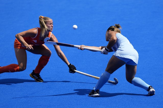 Netherlands' Joosje Burg, left, reacts after Argentina's Agustina Gorzelany's stick catches her on the face during the women's semifinal field hockey match between Argentina and Netherlands at the Yves-du-Manoir Stadium during the 2024 Summer Olympics, Wednesday, August 7, 2024, in Colombes, France. (Photo by Aijaz Rahi/AP Photo)