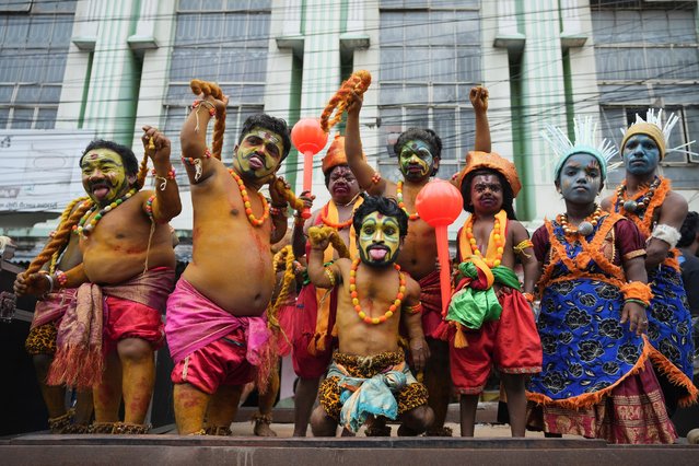 Dwarf artists dressed as Pothuraju, a mythical character, performs rituals during the Bonalu festival in Hyderabad, India, Monday, July 29, 2024. (Photo by Mahesh Kumar A./AP Photo)