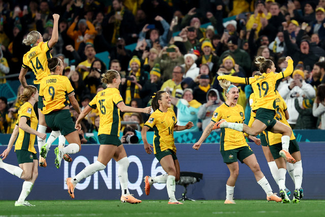 Australia's players celebrate after defender #07 Stephanie Catley scored a penalty during the Australia and New Zealand 2023 Women's World Cup Group B football match between Australia and Ireland at Stadium Australia, also known as Olympic Stadium, in Sydney on July 20, 2023. (Photo by David Gray/AFP Photo)