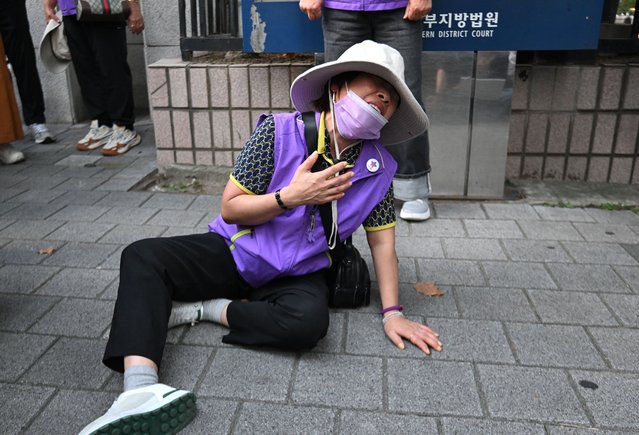 A family member of Itaewon crush victims cries at the Seoul Western District Court in Seoul on September 30, 2024, after Yongsan-gu District Office mayor Park Hee-young was found not guilty in the Itaewon disaster case. A South Korean court handed a three year jail term September 30 to a former Seoul district police chief over a crush that killed more than 150 people, the Yonhap news agency reported. The Seoul court, however, found local official Park Hee-young, head of the Yongsan Ward office, not guilty on similar charges. (Photo by Jung Yeon-je/AFP Photo)