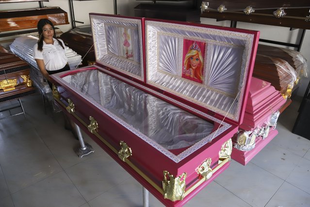 Pink colored coffins featuring a Barbie motif are displayed at a funeral home in Ahuachapan, El Salvador, Friday, August 4, 2023. According to the funeral home manager, the idea was well received as a joyful atmosphere to the loss of a loved one. (Photo by Salvador Melendez/AP Photo)