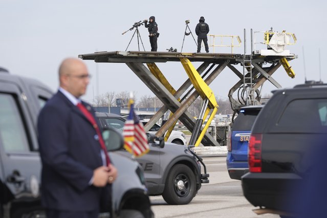 Secret Service counter-snipers monitor the scene as Democratic presidential nominee Vice President Kamala Harris arrives to board Air Force Two at Detroit Metropolitan Wayne County Airport in Detroit, Monday November 4, 2024, en route to Pennsylvania. (Photo by Jacquelyn Martin/AP Photo)