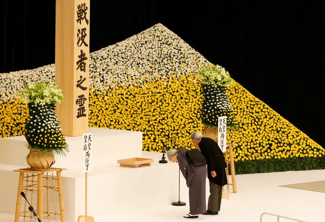 Japan's Emperor Akihito (R) and Empress Michiko bow at an altar for the war dead during a memorial ceremony marking the 72nd anniversary of Japan's surrender in World War Two, at Budokan Hall in Tokyo, Japan August 15, 2017. (Photo by Kim Kyung-Hoon/Reuters)