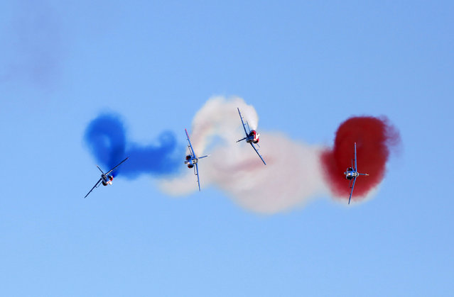 Alpha jets of the Patrouille de France, the aerobatic team of the French Air Force, perform during the Malta International Airshow over Malta International Airport outside Valletta, September 25, 2010. (Photo by Darrin Zammit Lupi/Reuters)