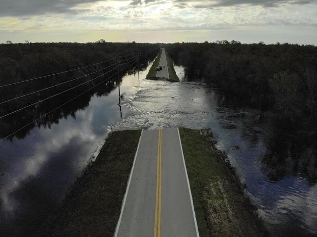 A destroyed road is seen after Hurricane Ian caused widespread destruction in Brownville, Florida, U.S., October 4, 2022. (Photo by Marco Bello/Reuters)