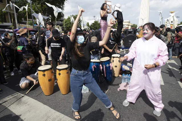 Pro-democracy students dance during a rally in Bangkok, Thailand, Sunday, August 16, 2020. Protesters have stepped up pressure on the government if it failed to meet their demands, which include holding of new elections, amending the constitution, and an end to intimidation of critics. (Photo by Sakchai Lalit/AP Photo)