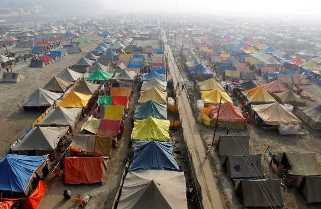 A general view of a giant tent city built for pilgrims attending the Magh Mela, a month-long Hindu festival, on a foggy winter morning in Allahabad, India, January 5, 2018. (Photo by Jitendra Prakash/Reuters)