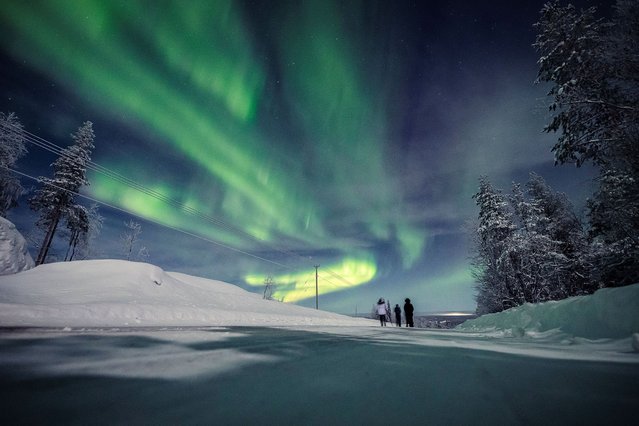 An aurora is seen in the sky in Pajala, Sweden on February 10, 2022. (Photo by Alexander Kuznetsov/Reuters)