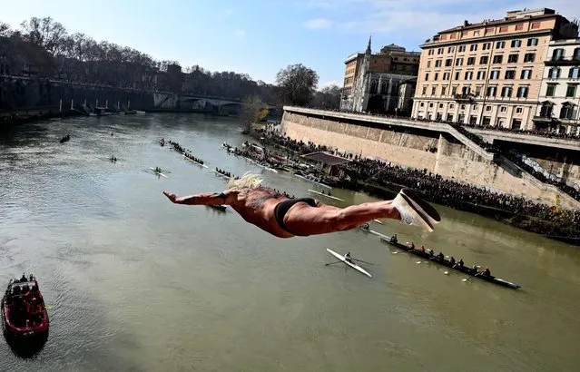 Maurizio Palmulli known as “Mister Ok” dives into the Tiber river as part of the traditional New Year celebrations on January 1, 2023 in Rome, Italy. (Photo by Tiziana Fabi/AFP Photo)