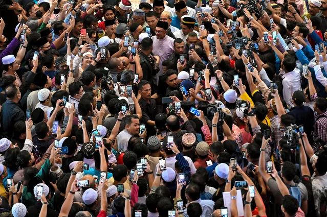 Newly elected Malaysia's Prime Minister Anwar Ibrahim meets supporters during his first public appearance, attending Friday prayer at a mosque in Putrajaya, Malaysia November 25, 2022. (Photo by Zahim Mohd/NurPhoto via Getty Images)