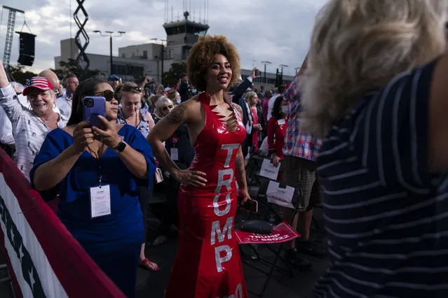 Supporters of President Donald Trump watch as he arrives to speak at a campaign rally at Smith Reynolds Airport, Tuesday, September 8, 2020, in Winston-Salem, N.C. (Photo by Evan Vucci/AP Photo)