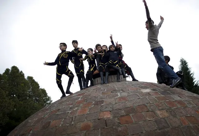 Young dancers play on the roof of a sulphite bath before their performance during the annual Tbilisoba festival, celebrating Tbilisi City Day in Tbilisi, Georgia, October 17, 2015. (Photo by David Mdzinarishvili/Reuters)