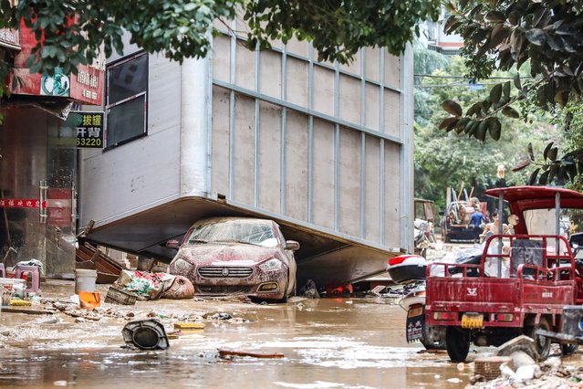 Debris is pictured on a street after floodwaters receded in Rongjiang county, Guizhou province, China on June 25, 2025. (Photo by cnsphoto via Reuters)