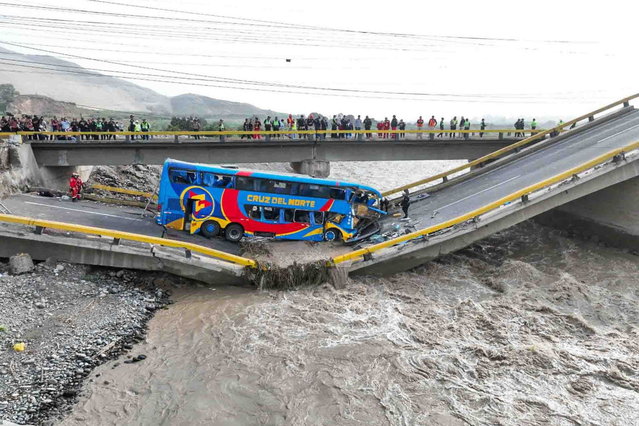 A handout photo made available by Peruvian Andina Agencia shows a bridge collapsed on the road between Lima and the port of Chancay, Peru, 14 February 2025. (Photo by Juan Carlos Guzman Negrin/EPA)