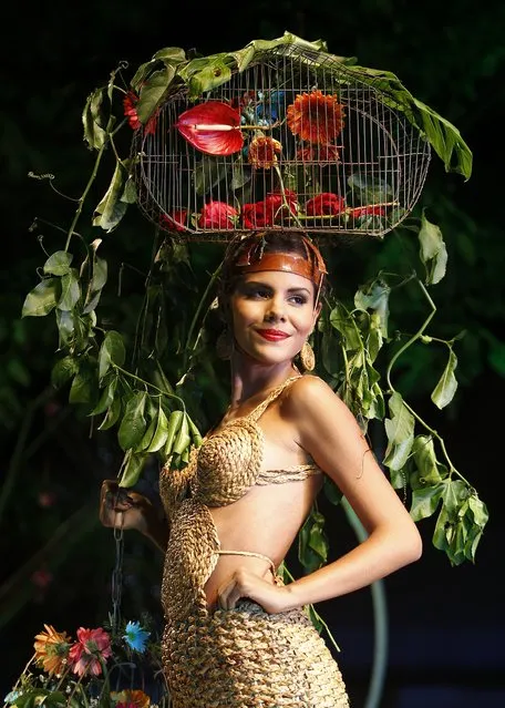 A model presents a creation during the Biofashion show in Cali November 29, 2014. The designs are made from plants, recycled and natural materials. (Photo by Jaime Saldarriaga/Reuters)
