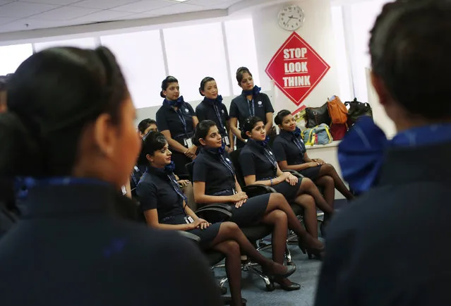 Prospective flight attendants listen to their instructor during an etiquette training course at Indigo Airlines' Ifly training centre in Gurgaon on the outskirts of New Delhi November 18, 2014. (Photo by Adnan Abidi/Reuters)
