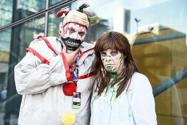 Comic Con attendees pose as Twisty the killer clown and the Exorcist during 2016 New York Comic Con – Day 1 on October 6, 2016 in New York City. (Photo by Daniel Zuchnik/Getty Images)