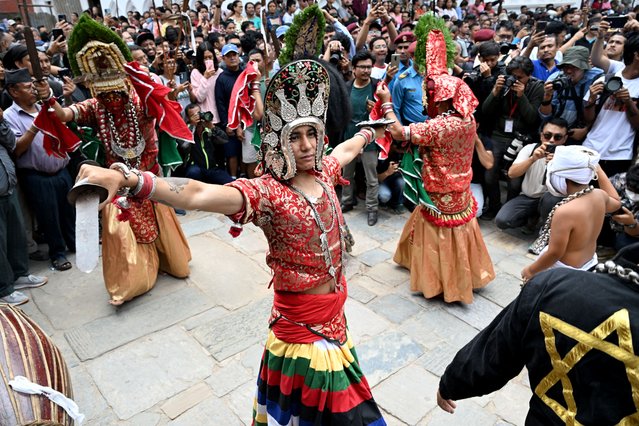 Traditional masked dancers perform on the first day of the Indra Jatra festival at Hanuman Dhoka in Kathmandu on September 4, 2025. (Photo by Prakash Mathema/AFP Photo)