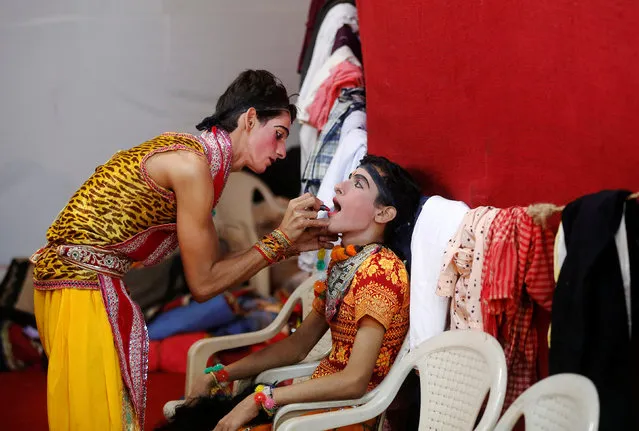 Artists get ready backstage before performing Ramlila, a re-enactment of the life of Hindu Lord Rama, during Vijaya Dashmi or Dussehra festival celebrations in Mumbai, India October 11, 2016. (Photo by Shailesh Andrade/Reuters)