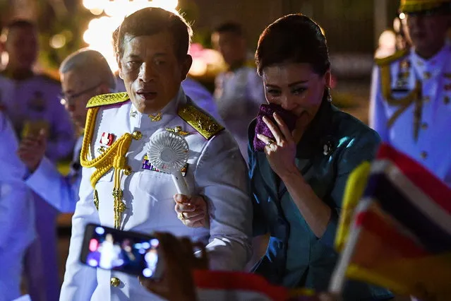 Thailand's King Maha Vajiralongkorn and Queen Suthida greet royalists during their appearance in Bangkok, Thailand, November 25, 2020. (Photo by Chalinee Thirasupa/Reuters)