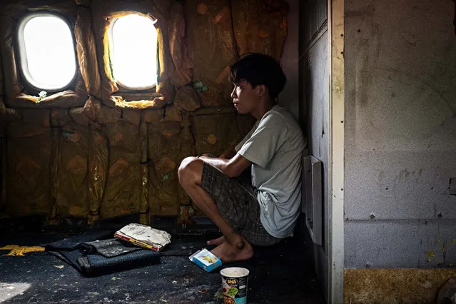 This young man and his family have lived in the abandoned planes for years. (Photo by Lauren DeCicca/The Guardian)